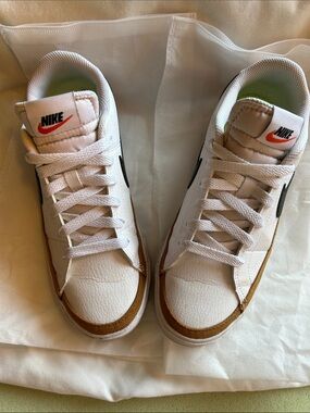 Nike Women’s White Sneakers with Brown Trim and Black Swoosh